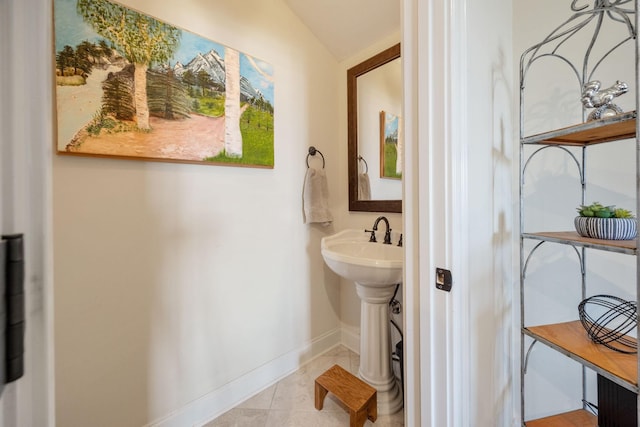 891 Fairington Pvt Way, Gallatin, TN 37066 - bathroom with baseboards, vaulted ceiling, and tile patterned floors