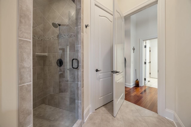 891 Fairington Pvt Way, Gallatin, TN 37066 - full bathroom featuring tile patterned flooring, a shower stall, and baseboards