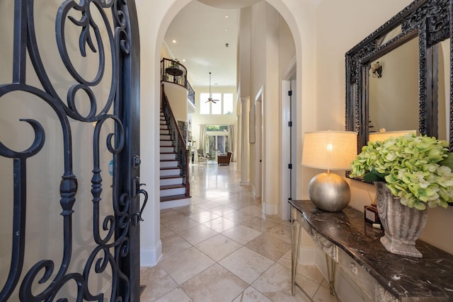 891 Fairington Pvt Way, Gallatin, TN 37066 - foyer entrance featuring arched walkways, stairs, and baseboards