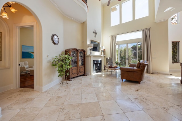 891 Fairington Pvt Way, Gallatin, TN 37066 - entryway featuring a towering ceiling, arched walkways, a fireplace, and baseboards