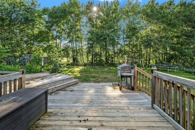 1012 Blue Ridge Pkwy, Goodlettsville, TN 37072 - wooden terrace featuring a trampoline, view of scattered trees, and grilling area