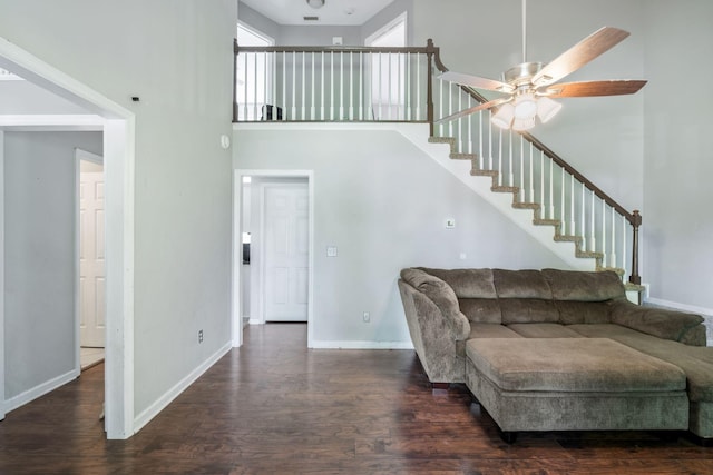 1012 Blue Ridge Pkwy, Goodlettsville, TN 37072 - living area featuring baseboards, wood finished floors, a high ceiling, and stairway