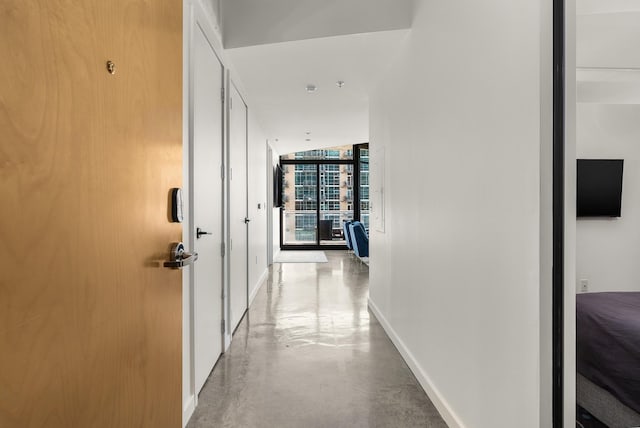 600 12th Ave S Unit 1208, Nashville, TN 37203 - hallway with baseboards and finished concrete floors