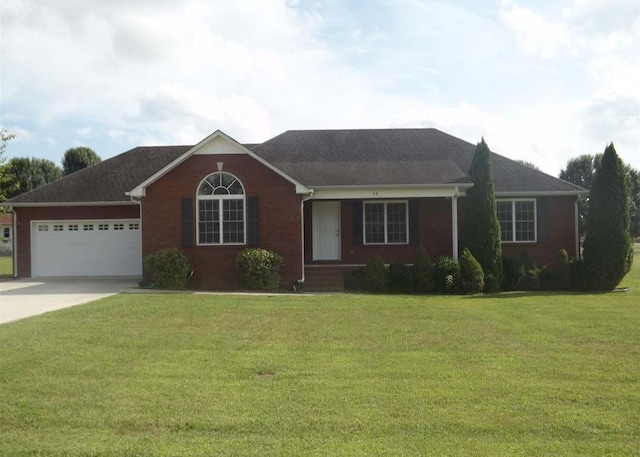 38 Falcon Dr, Manchester, TN 37355 - ranch-style home with an attached garage, concrete driveway, a front lawn, and brick siding