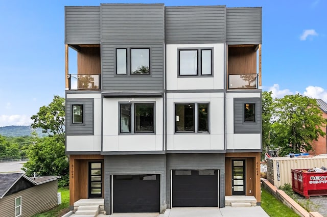 6104 Cowden Ave Unit A, Nashville, TN 37209 - modern home with driveway, a garage, and stucco siding
