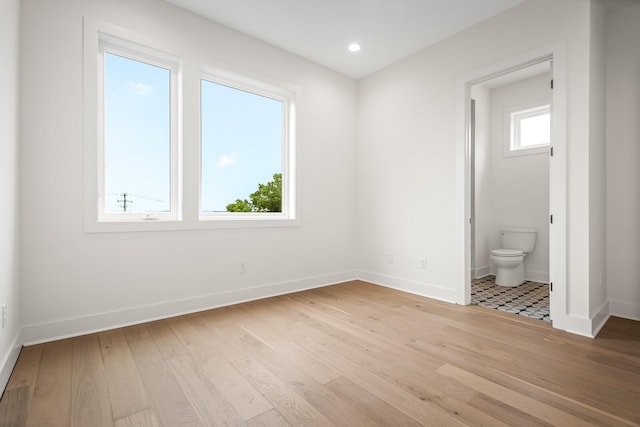 6104 Cowden Ave Unit A, Nashville, TN 37209 - unfurnished bedroom with baseboards, light wood-style flooring, ensuite bathroom, and recessed lighting