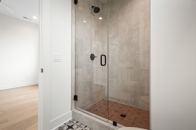 6104 Cowden Ave Unit A, Nashville, TN 37209 - bathroom featuring a stall shower, baseboards, recessed lighting, and wood finished floors