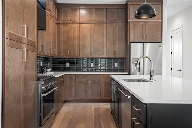 6104 Cowden Ave Unit A, Nashville, TN 37209 - kitchen featuring stainless steel appliances, a sink, light wood-type flooring, and light countertops
