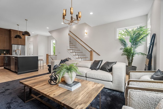 6104 Cowden Ave Unit A, Nashville, TN 37209 - living area with light wood-style flooring, stairs, a chandelier, and recessed lighting