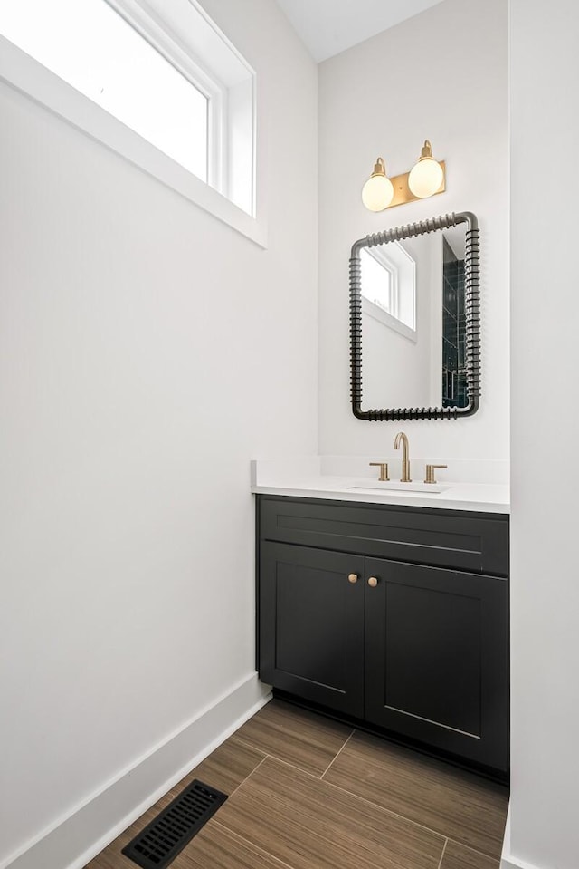 6104 Cowden Ave Unit A, Nashville, TN 37209 - bathroom with vanity, baseboards, and wood finished floors