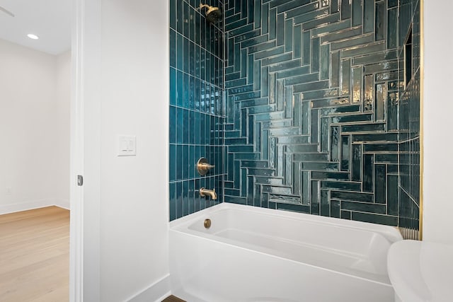 6104 Cowden Ave Unit A, Nashville, TN 37209 - bathroom featuring shower / bathtub combination, baseboards, toilet, and wood finished floors