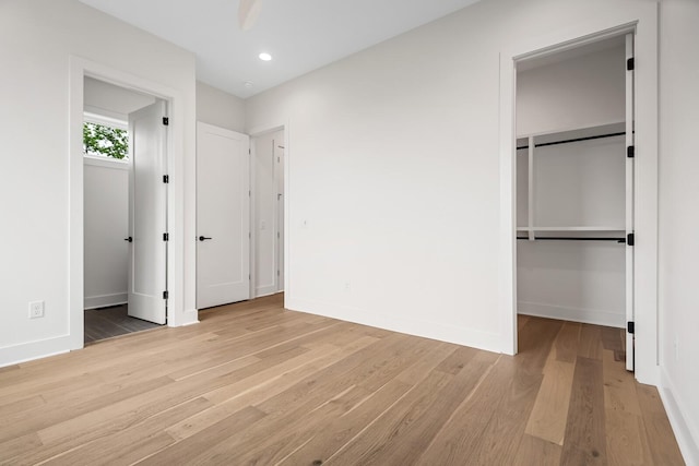 6104 Cowden Ave Unit A, Nashville, TN 37209 - unfurnished bedroom with a walk in closet, light wood-style flooring, baseboards, recessed lighting, and a closet