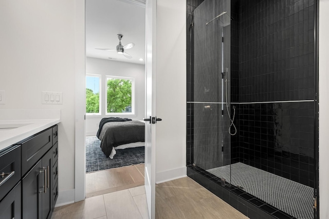 6104 Cowden Ave Unit A, Nashville, TN 37209 - full bathroom featuring a shower stall, ceiling fan, vanity, ensuite bathroom, and baseboards