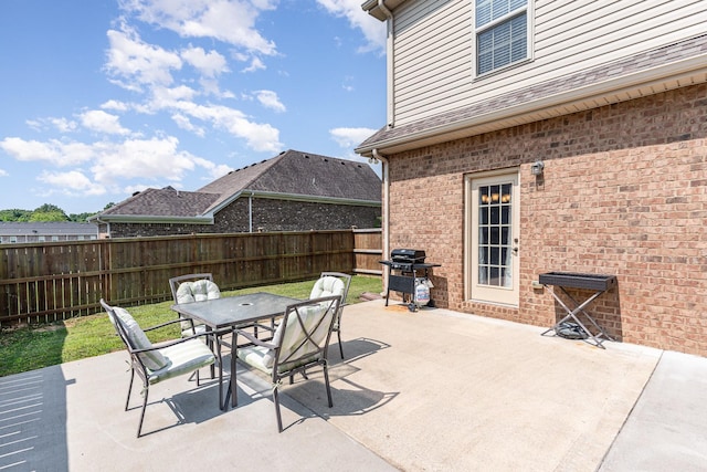 1026 Grace Meade, Ashland City, TN 37015 - fenced backyard featuring grilling area, outdoor dining space, and a patio area