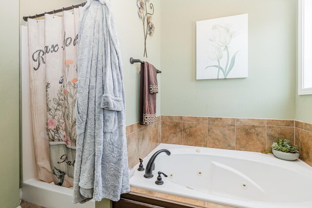 1026 Grace Meade, Ashland City, TN 37015 - bathroom featuring a whirlpool tub and a shower with shower curtain