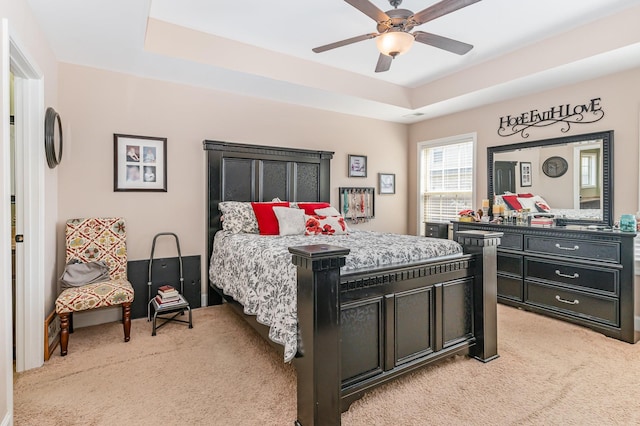 1026 Grace Meade, Ashland City, TN 37015 - bedroom with light colored carpet, a raised ceiling, and a ceiling fan