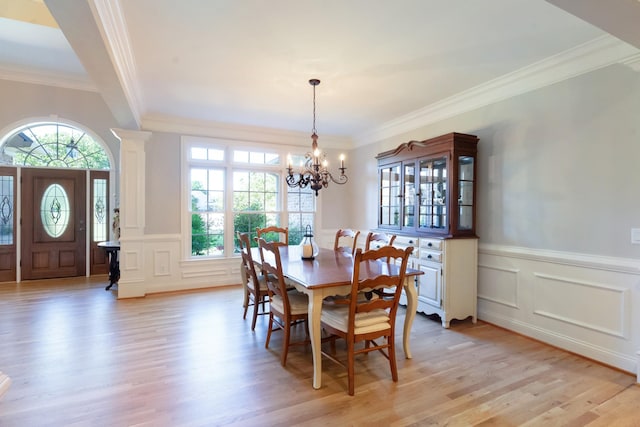 205 Saint Anne Way, Franklin, TN 37064 - dining room featuring a decorative wall, crown molding, healthy amount of natural light, light wood-style floors, and a chandelier