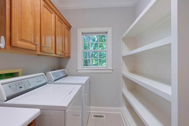 205 Saint Anne Way, Franklin, TN 37064 - laundry room with cabinet space, washing machine and clothes dryer, baseboards, ornamental molding, and light tile patterned flooring