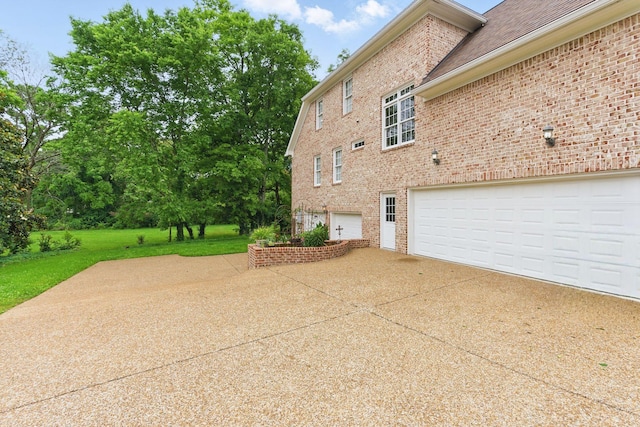 205 Saint Anne Way, Franklin, TN 37064 - view of side of home with brick siding, driveway, and a yard