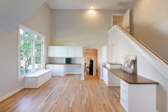 205 Saint Anne Way, Franklin, TN 37064 - unfurnished office featuring built in study area, a towering ceiling, light wood finished floors, and baseboards