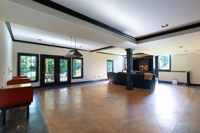 205 Saint Anne Way, Franklin, TN 37064 - unfurnished living room with crown molding, ornate columns, plenty of natural light, tile patterned flooring, and recessed lighting