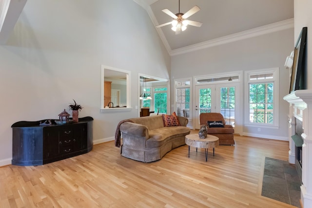 205 Saint Anne Way, Franklin, TN 37064 - living room featuring high vaulted ceiling, crown molding, light wood-type flooring, a ceiling fan, and baseboards
