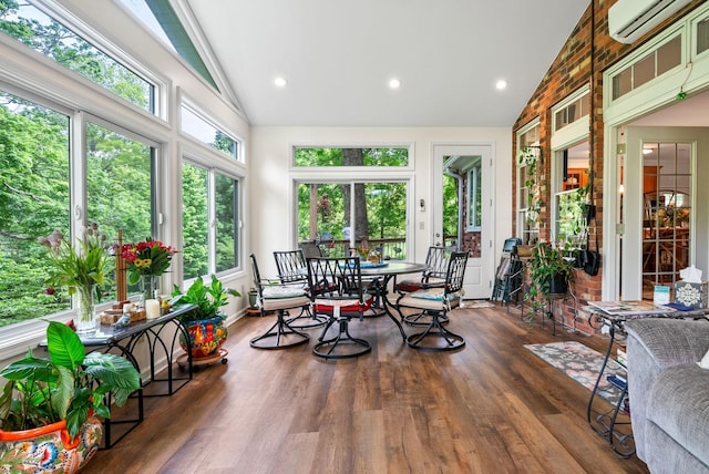 1711 Lovers Ln, Hopkinsville, KY 42240 - sunroom / solarium with a wall mounted AC, wood finished floors, high vaulted ceiling, baseboards, and recessed lighting
