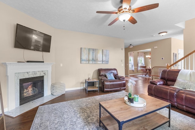 3182 Tristan Dr, Franklin, TN 37064 - living area with ceiling fan, wood finished floors, a premium fireplace, stairs, and baseboards