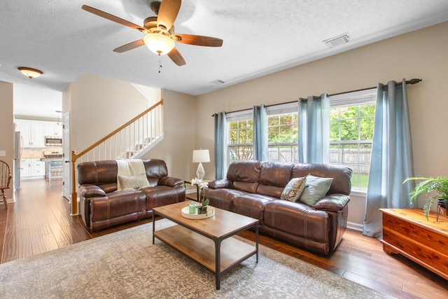 3182 Tristan Dr, Franklin, TN 37064 - living area with hardwood / wood-style floors, plenty of natural light, ceiling fan, and a textured ceiling