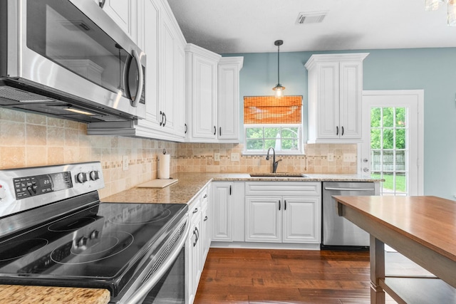 3182 Tristan Dr, Franklin, TN 37064 - kitchen featuring stainless steel appliances, a sink, white cabinetry, and dark wood-style flooring