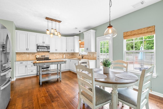 3182 Tristan Dr, Franklin, TN 37064 - dining space featuring dark wood finished floors and a chandelier