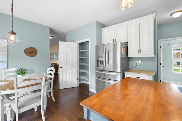 3182 Tristan Dr, Franklin, TN 37064 - kitchen featuring stainless steel fridge with ice dispenser, white cabinetry, dark wood-style floors, pendant lighting, and baseboards