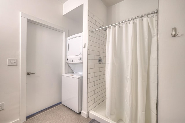 1900 12th Ave S Unit 406, Nashville, TN 37203 - full bath featuring stacked washer / drying machine and a tile shower