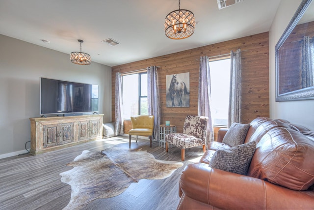 1900 12th Ave S Unit 406, Nashville, TN 37203 - living room with wood finished floors, baseboards, and wood walls