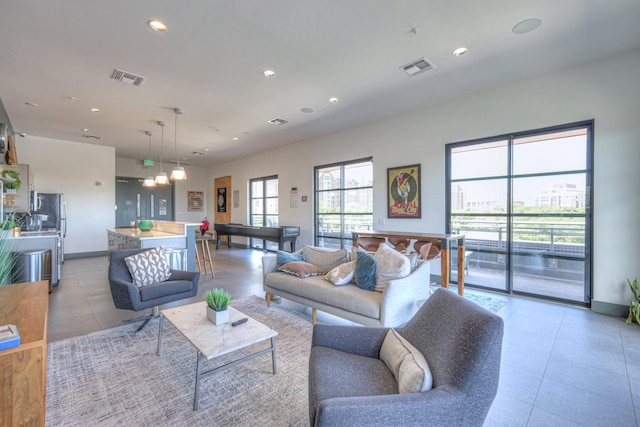 1900 12th Ave S Unit 406, Nashville, TN 37203 - living area with light tile patterned flooring and recessed lighting