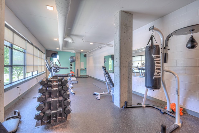 1900 12th Ave S Unit 406, Nashville, TN 37203 - workout area with concrete block wall, baseboards, and recessed lighting