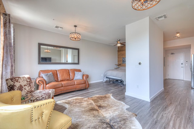 1900 12th Ave S Unit 406, Nashville, TN 37203 - living area with wood finished floors, baseboards, and ceiling fan