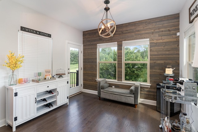 1717 Boardwalk Pl, Gallatin, TN 37066 - living area featuring wooden walls, healthy amount of natural light, baseboards, dark wood finished floors, and a chandelier