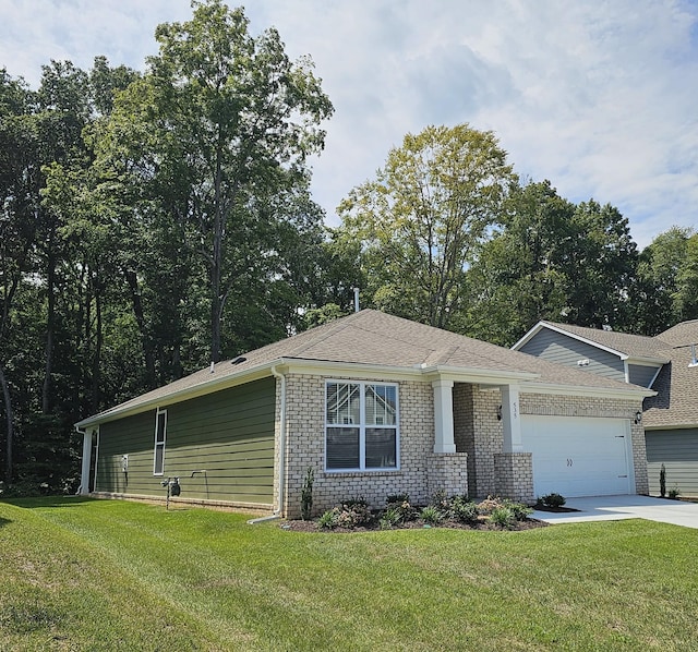 535 Ballard Dr, White House, TN 37188 - view of front of house with concrete driveway, an attached garage, a front lawn, and brick siding