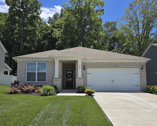 535 Ballard Dr, White House, TN 37188 - view of front of home featuring brick siding, a garage, concrete driveway, and a shingled roof