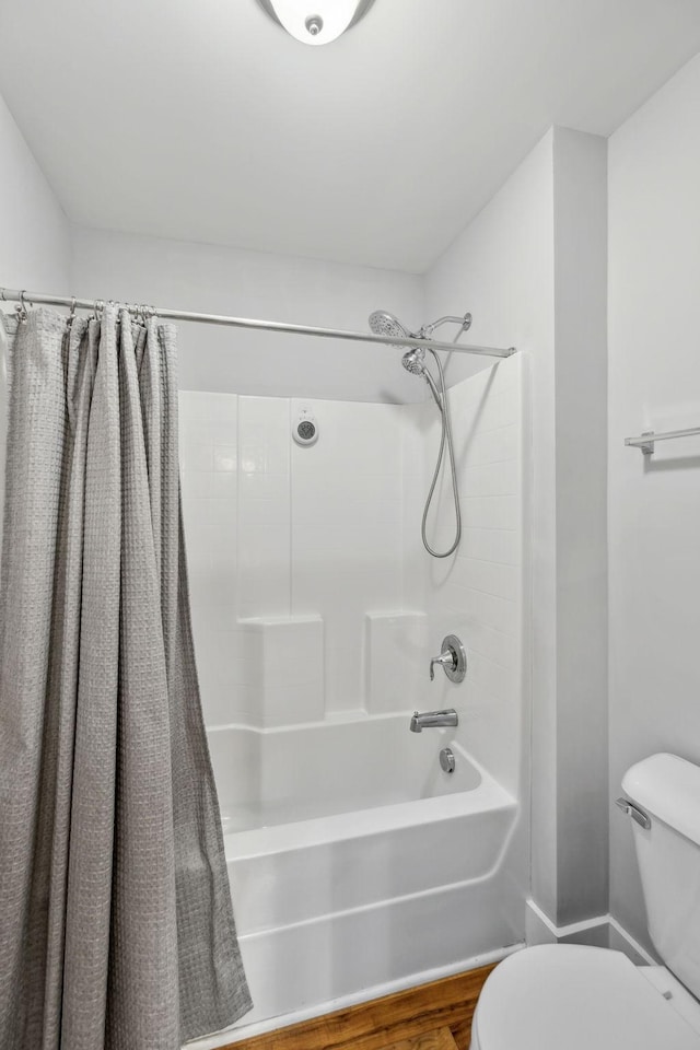 1151 Cotillion Dr, Murfreesboro, TN 37128 - bathroom with toilet, shower / bath combination with curtain, and wood finished floors