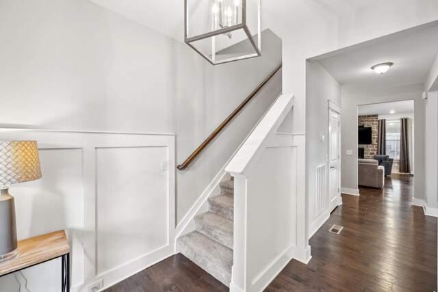 1151 Cotillion Dr, Murfreesboro, TN 37128 - stairs featuring wood finished floors and a fireplace