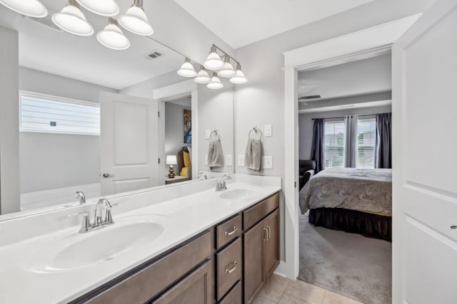 1151 Cotillion Dr, Murfreesboro, TN 37128 - ensuite bathroom with double vanity and tile patterned floors