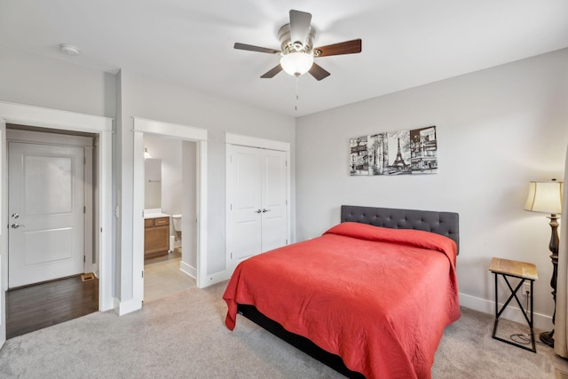 1151 Cotillion Dr, Murfreesboro, TN 37128 - carpeted bedroom with baseboards, a closet, connected bathroom, and ceiling fan