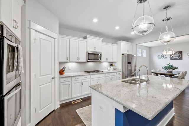 1151 Cotillion Dr, Murfreesboro, TN 37128 - kitchen with a sink, appliances with stainless steel finishes, a chandelier, a center island with sink, and white cabinets