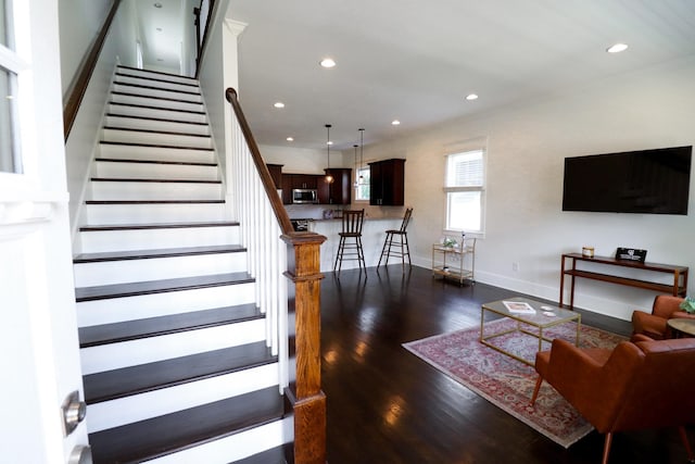 4802A Illinois Ave, Nashville, TN 37209 - living area with wood finished floors, crown molding, recessed lighting, stairway, and baseboards