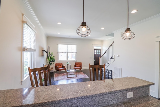 4802A Illinois Ave, Nashville, TN 37209 - kitchen featuring recessed lighting, ornamental molding, decorative light fixtures, baseboards, and stone counters