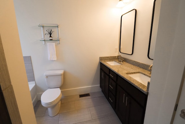 4802A Illinois Ave, Nashville, TN 37209 - full bathroom with double vanity, toilet, baseboards, a bath, and tile patterned floors