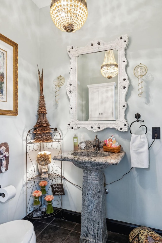 314 W 6th St Unit 7, Columbia, TN 38401 - bathroom featuring a chandelier, toilet, tile patterned floors, and baseboards