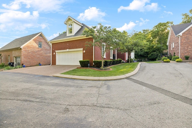 314 W 6th St Unit 7, Columbia, TN 38401 - view of front of house with driveway, brick siding, and a garage